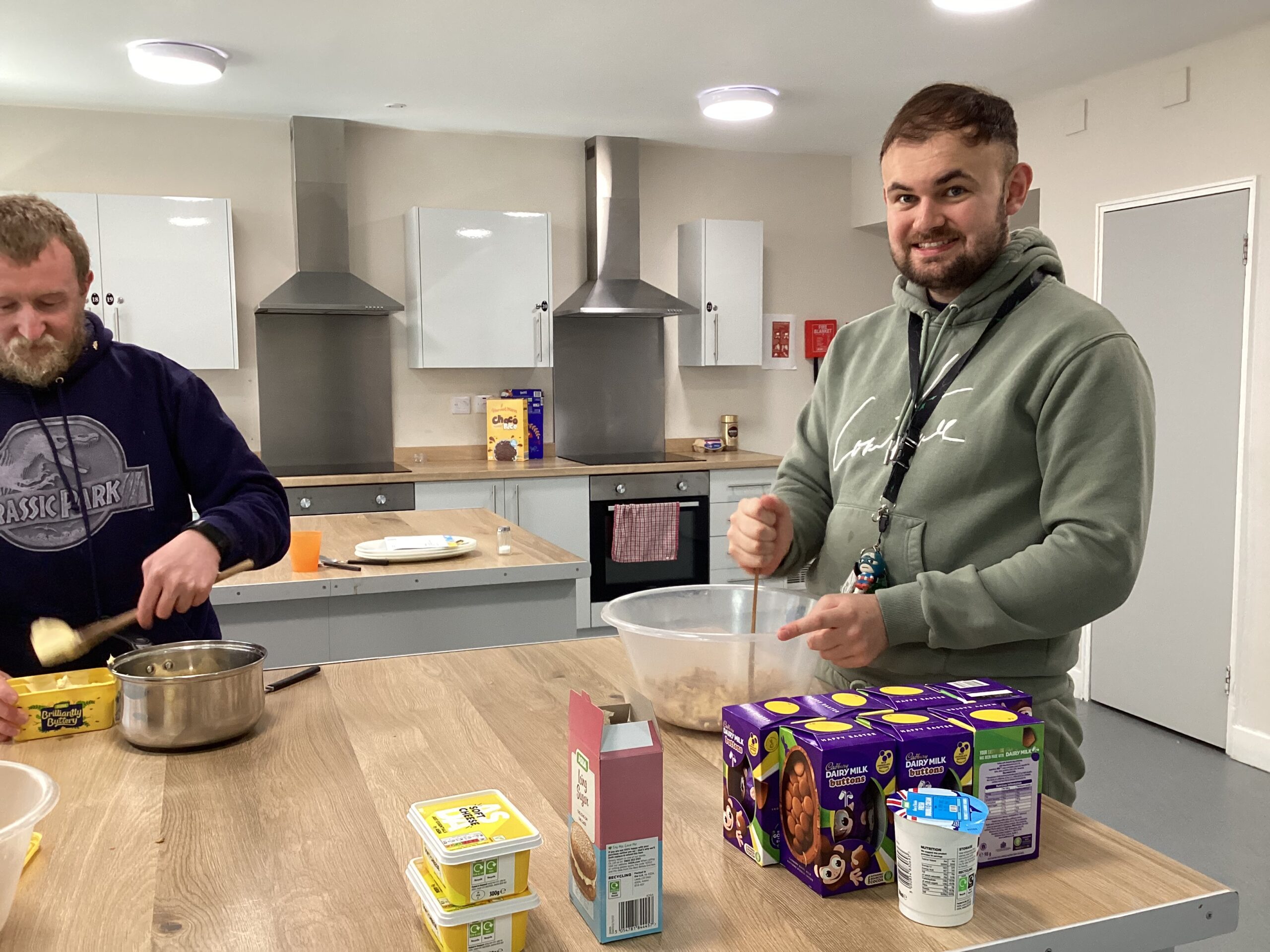 Resident filling an Easter egg with cheesecake mix