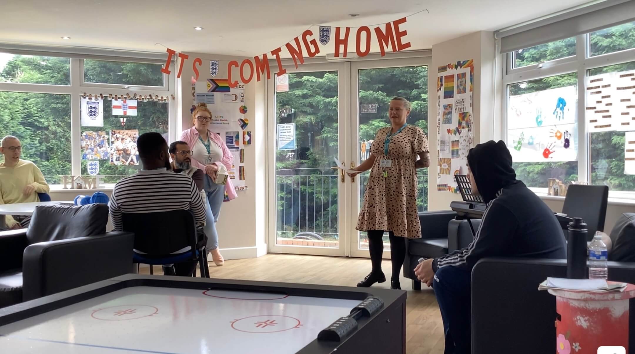 Lady speaking to group about inclusion