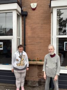 Residents stood in front of handmade planters