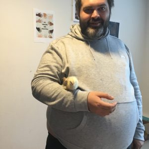resident holding a chick