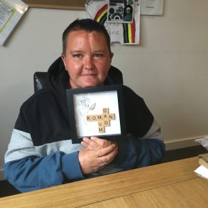 resident holding handmade personalised frame