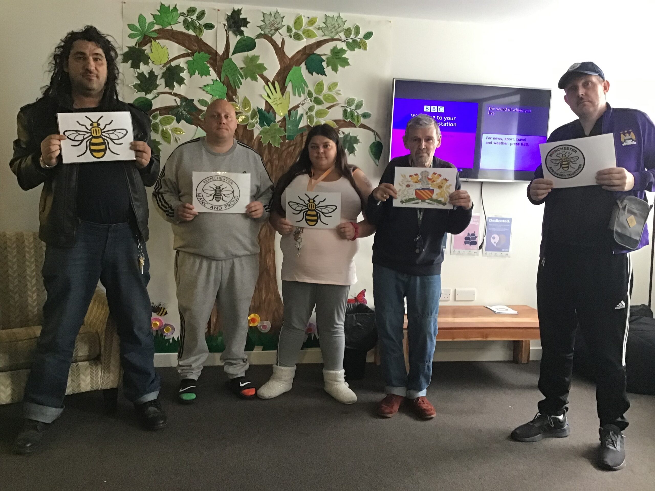 group of people holding posters