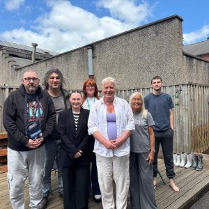 Staff and the people we support at Montgomery House in Bury, Greater Manchester, together in the process of renovating their garden.