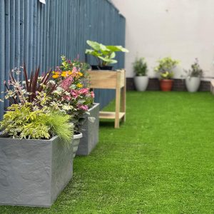 The final result of the garden makeover and renovation at Montgomery House in Bury, Greater Manchester, showing lovely raised flowerbeds.