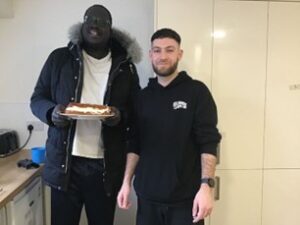 Resident baking with staff