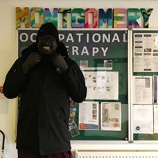 A resident enjoying his new glasses