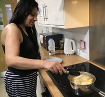 A resident enjoying a cooking session