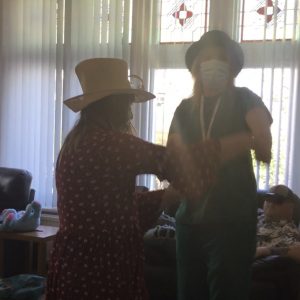 resident and team member dancing