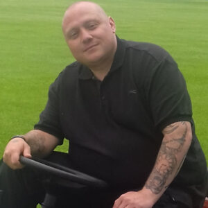 male on ride on lawnmower