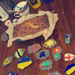 home made loaf cake and rock paintings