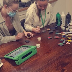 residents painting rocks