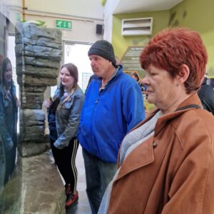 residents looking at museum display