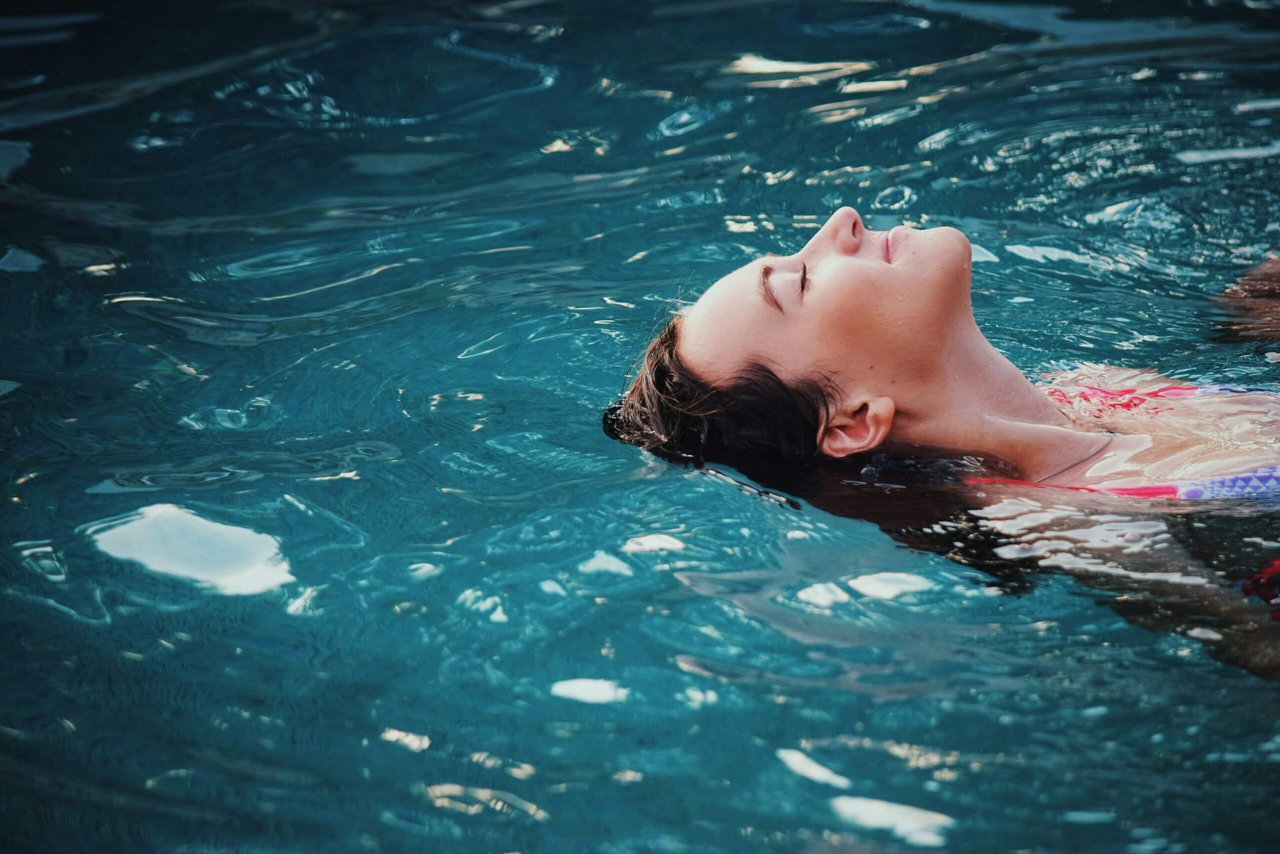 Lady relaxing in pool
