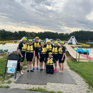 Amy Johnson team members group pic in yellow buoyancy aids