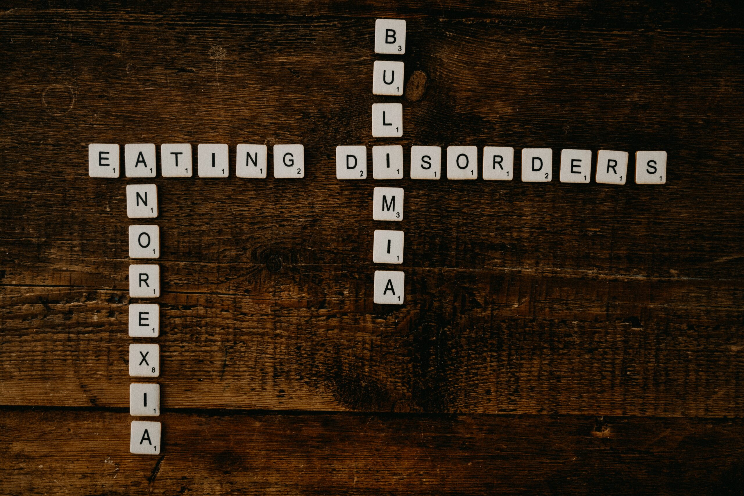 scrabble tiles spelling anorexia, eating disorder, bulimia