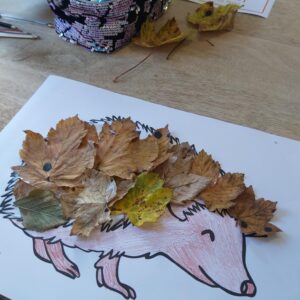hedgehog drawing with autumn leaves as spikes