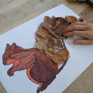 squirrel drawing with autumn leaves forming the tail