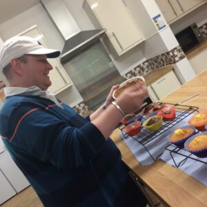 resident making cupcakes