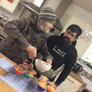 residents mixing cupcake mixture