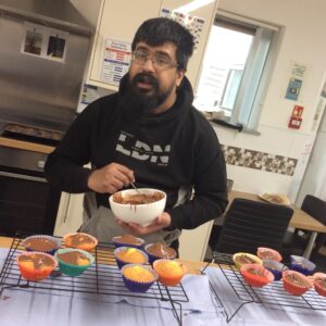 resident mixing cupcake mixture