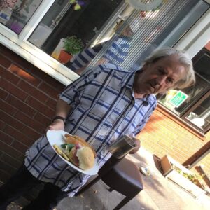 resident enjoying bbq outdoors