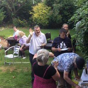 residents enjoying bbq in garden
