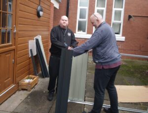 resident and team member building bike shed