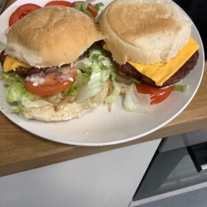 2 homemade burgers on a plate