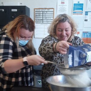 adding flour to cake mix