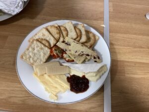 plate of cheese, crackers and chutney