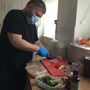 resident cooking chicken