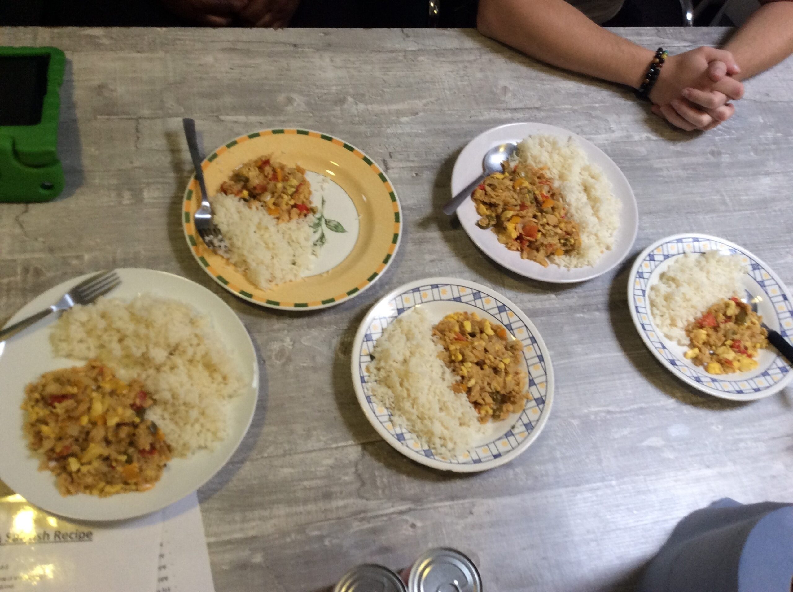 5 plates of food with rice