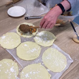 adding the filling to Cornish pasties