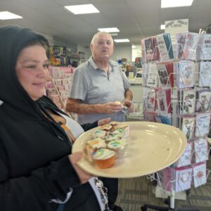 residents handing out cupcakes