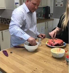 male resident baking cake