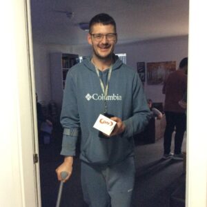 male in grey jumper holding aero easter egg