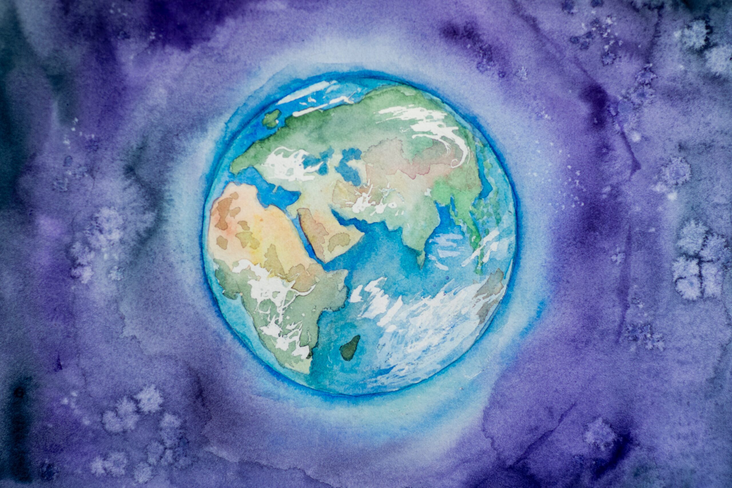 World Social Work Day: watercolour painting of Earth on purple background