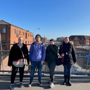 Four residents on a bridge