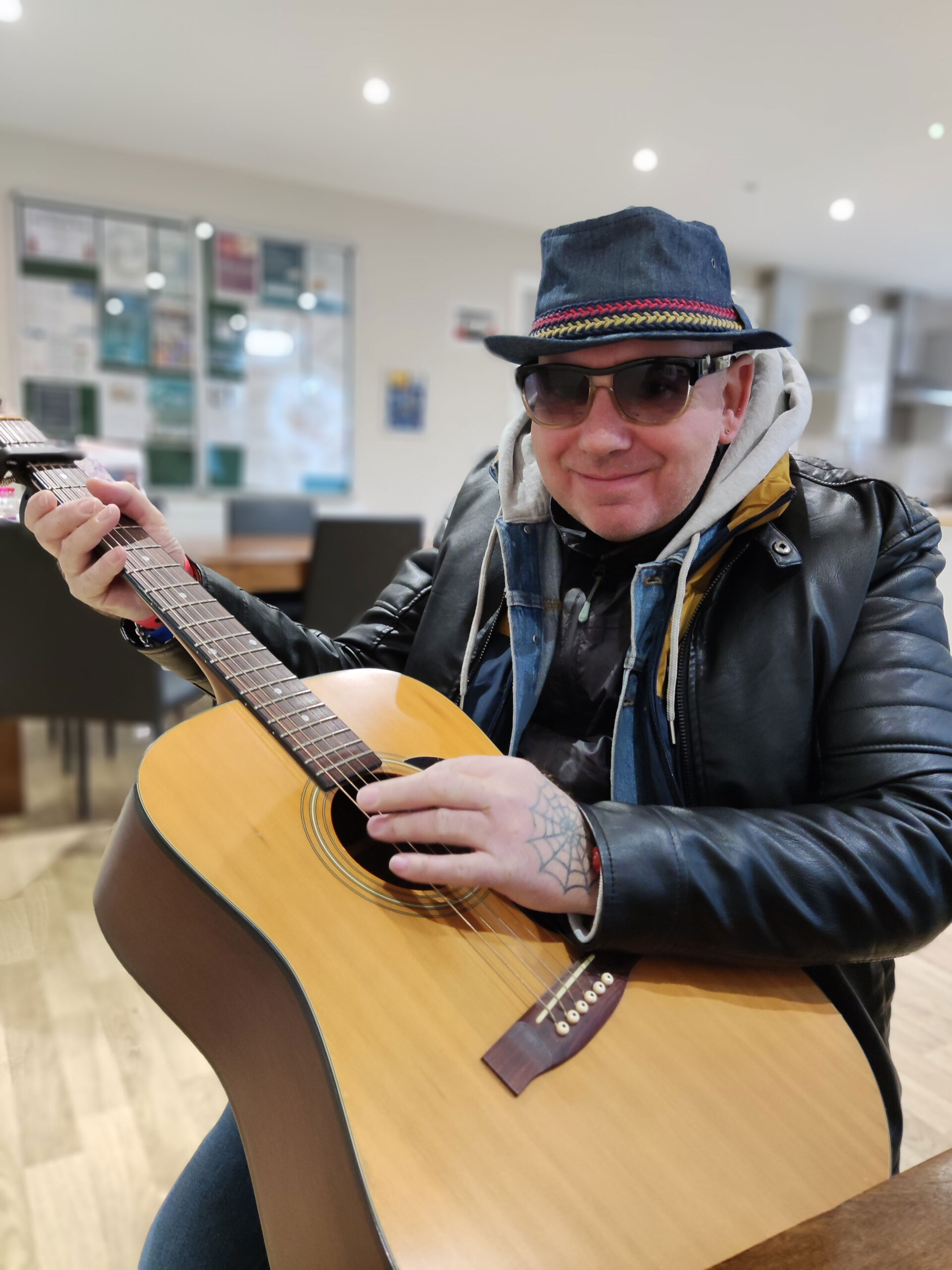 resident playing guitar