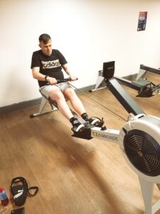resident at gym on rowing machine