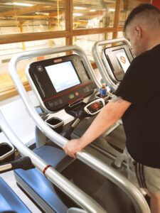 resident at gym on treadmill