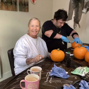 Residents carving pumpkins