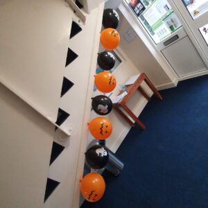 Halloween balloons pinned to stairway