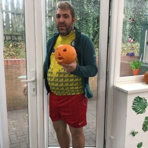 resident holding pumpkin