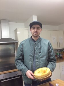 male holding homemade lemon tart