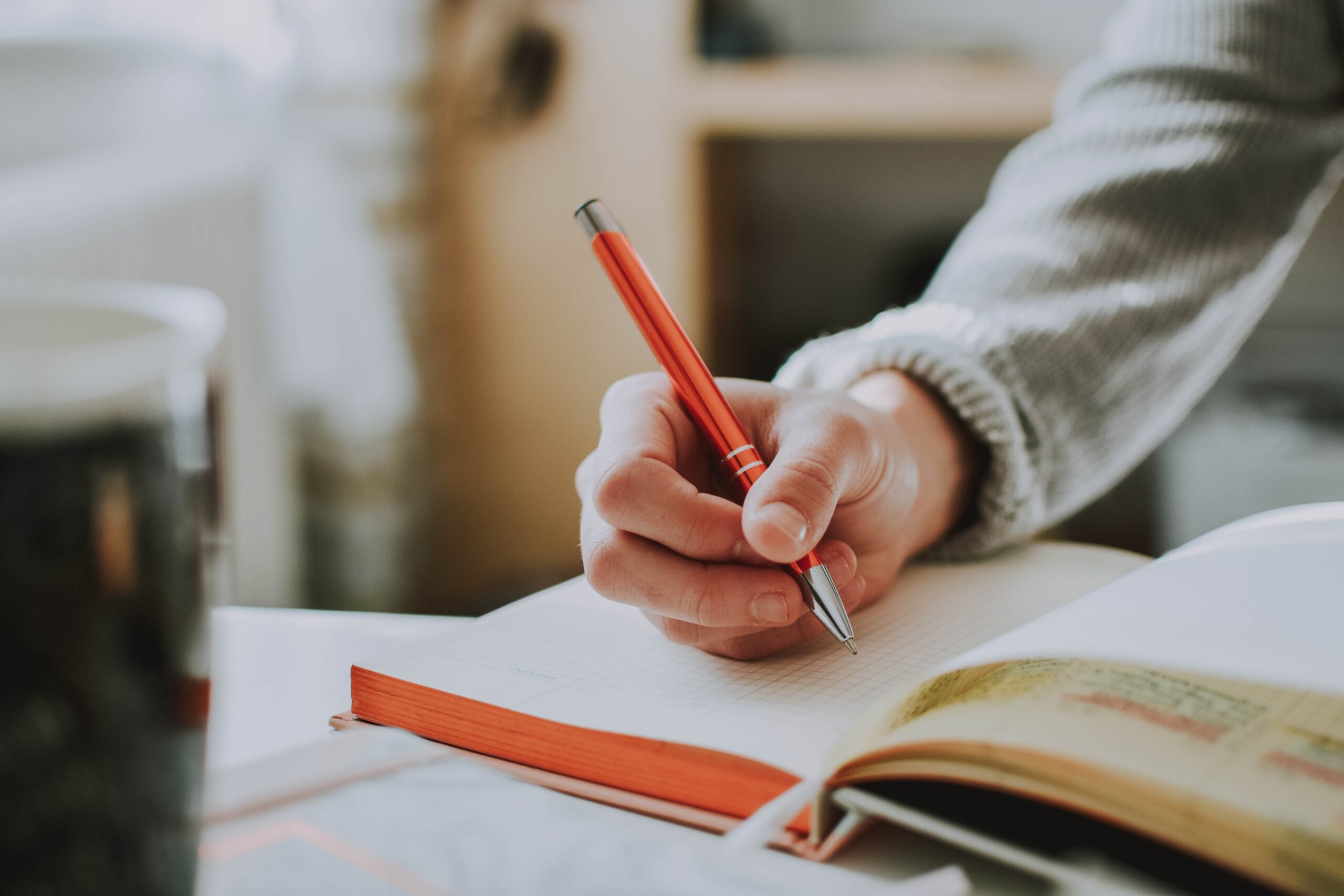 Dysgraphia: person writing in notebook