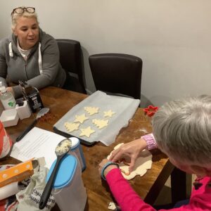 residents making christmas decorations