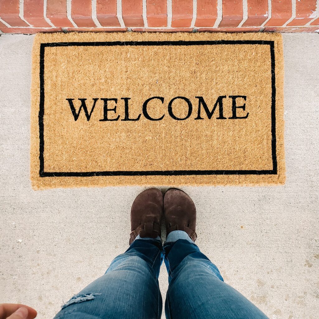 brown mat with black "welcome" lettering