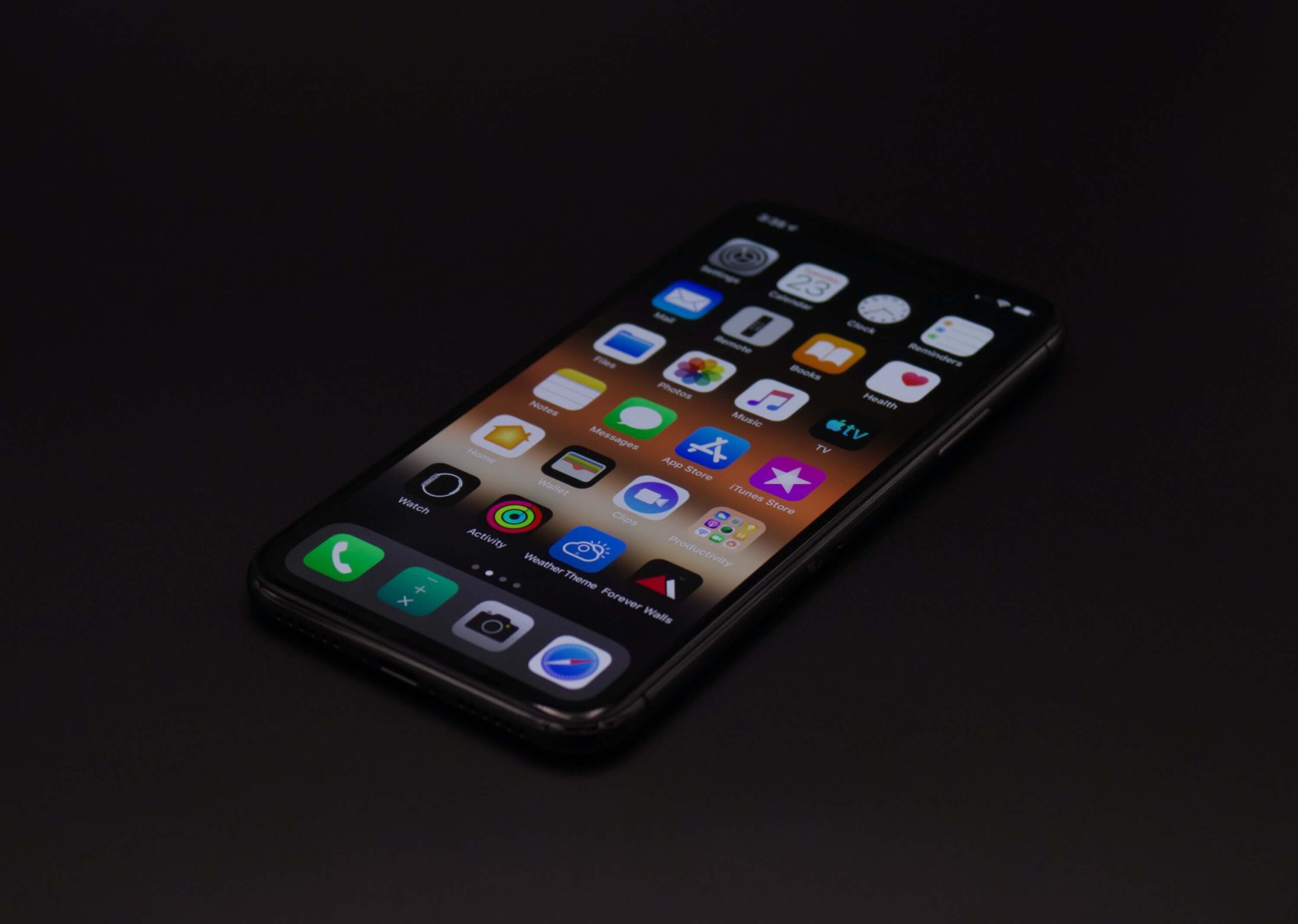 iPhone blue light glowing in darkness.
