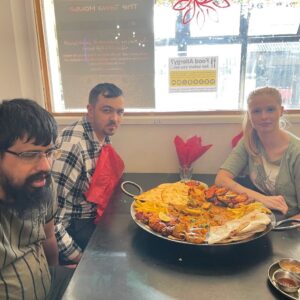 HPH team and residents with big plate of food
